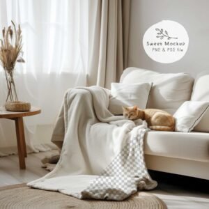 Cozy blanket mockup with a cat sleeping beside it on a sofa in a realistic living room scene